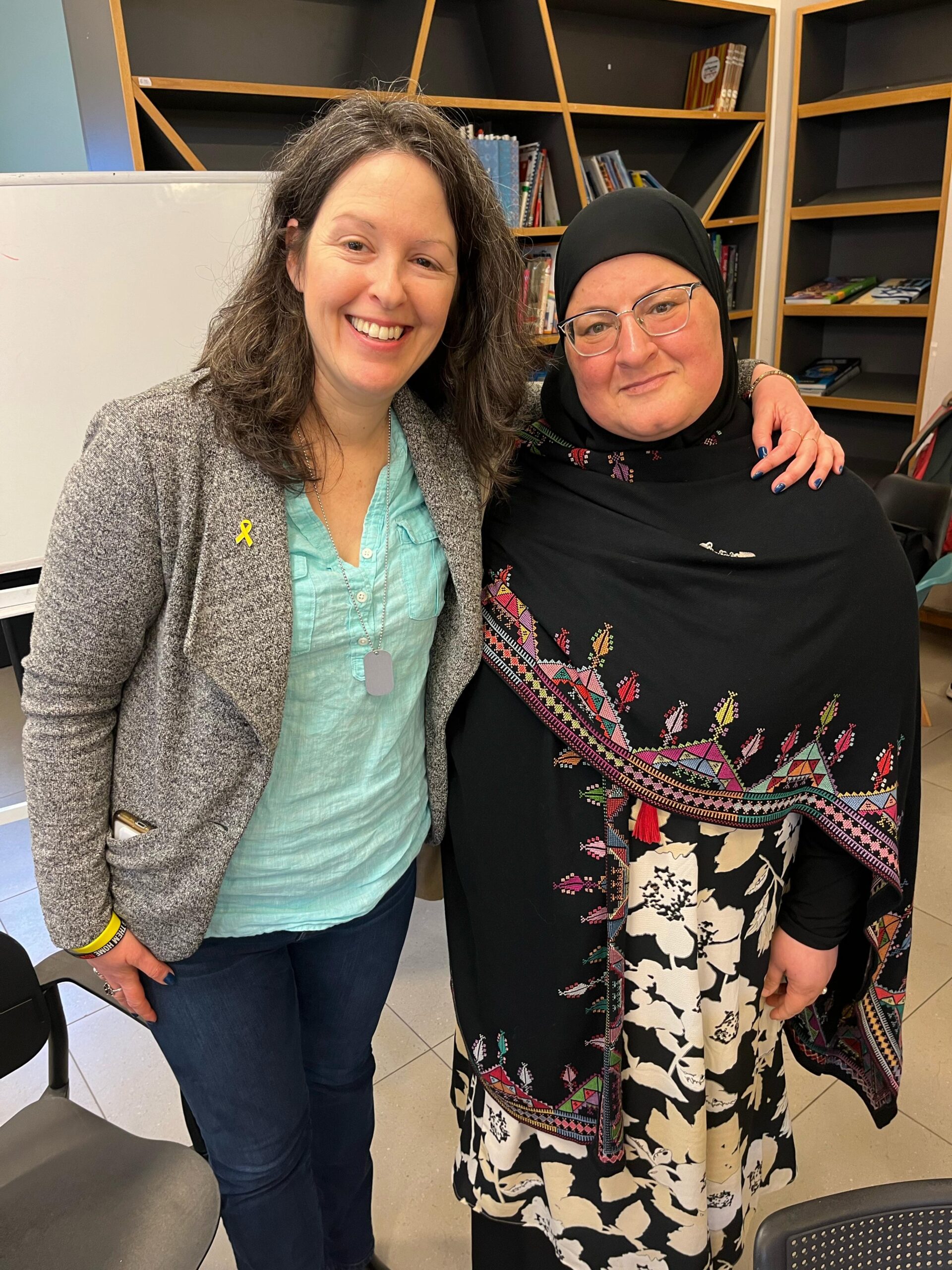Yael Birin, member of the Shared Society and Jewish Pluralism subcommittee standing with a Muslim woman.