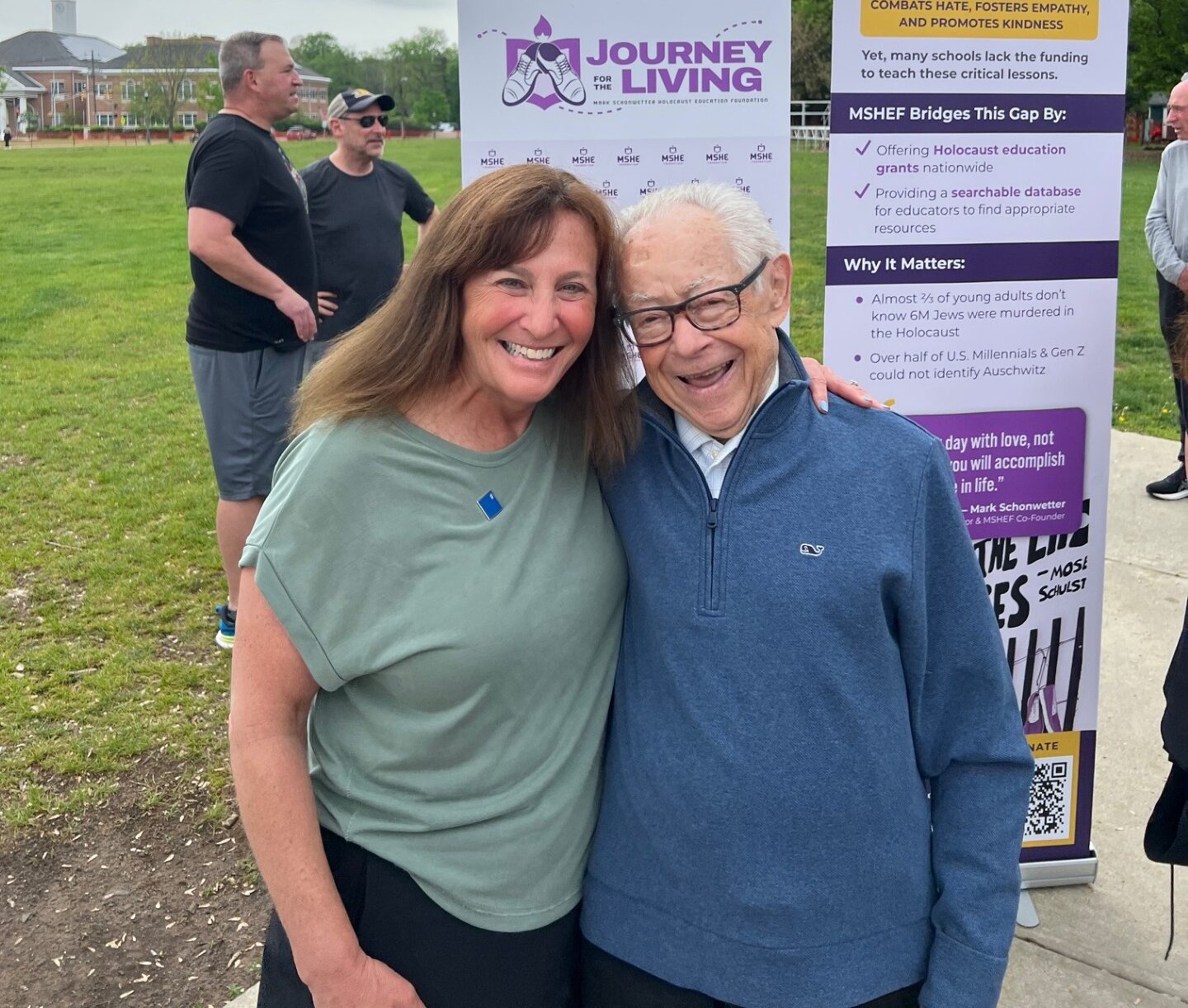 Jodi Cooperman standing with Holocaust survivor Mark Schonwetter at tMarch of the Living 2025 in Poland