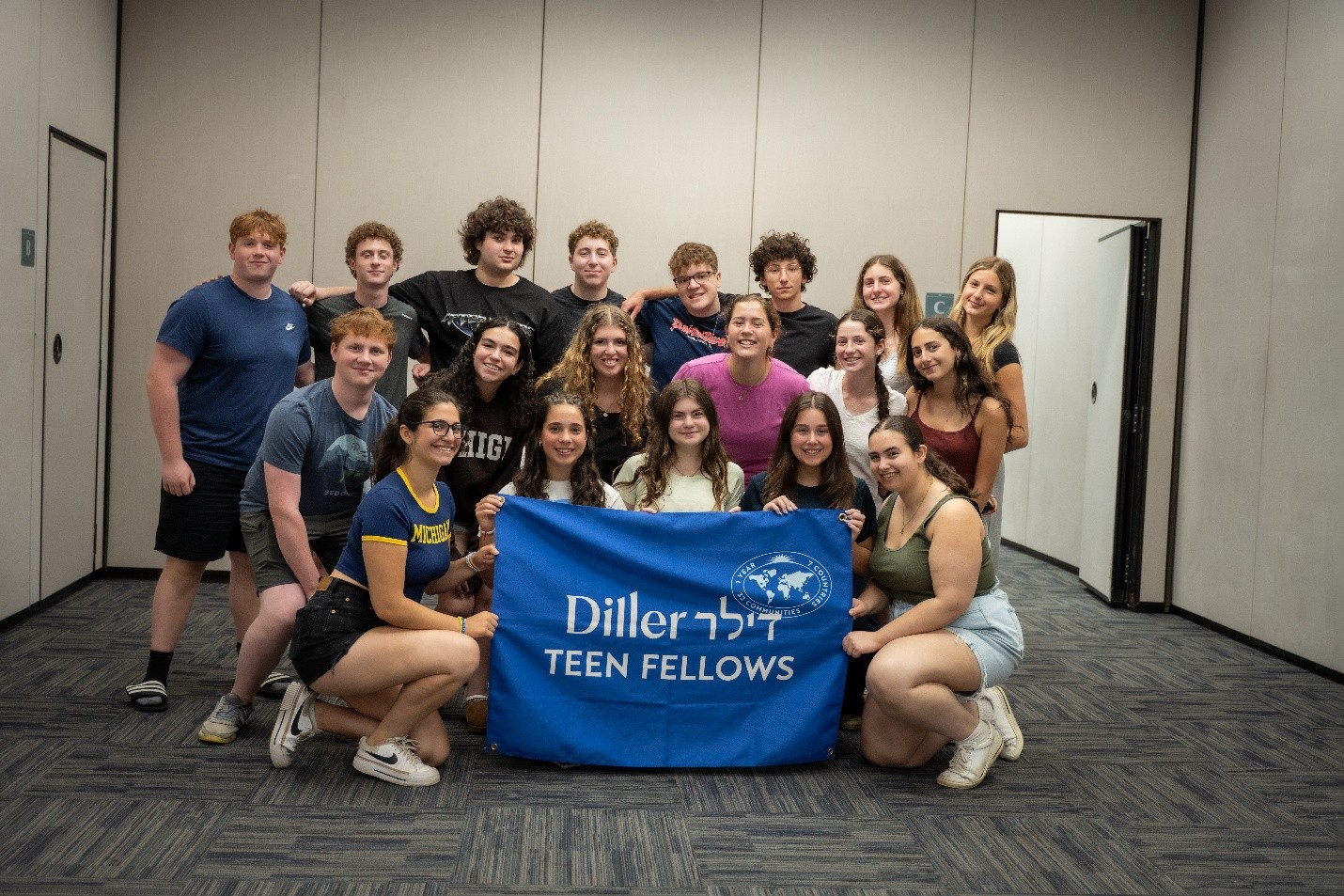 Diller Teens hold Diller banner