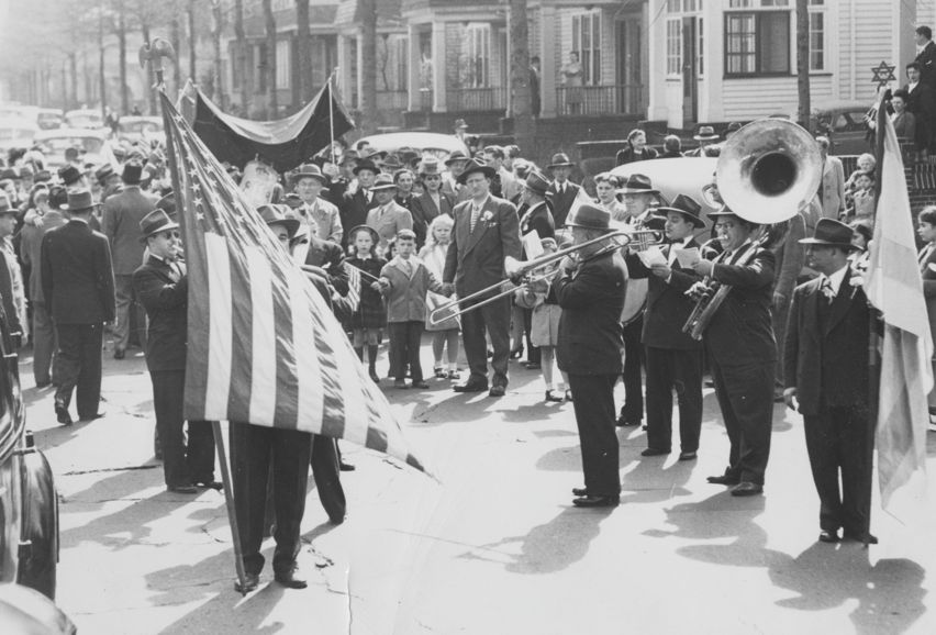 Torah parade with American flag outside of Wainwright Street Synagogue