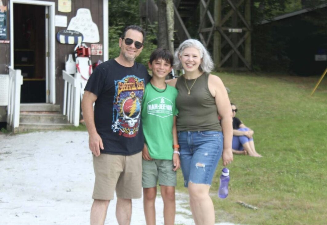 Paula Mensch with her husband and son at NJY camps in summer 2025.