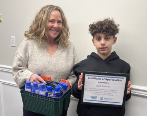 Jacob receives award for raising funds and camp supplies for Jewish campers