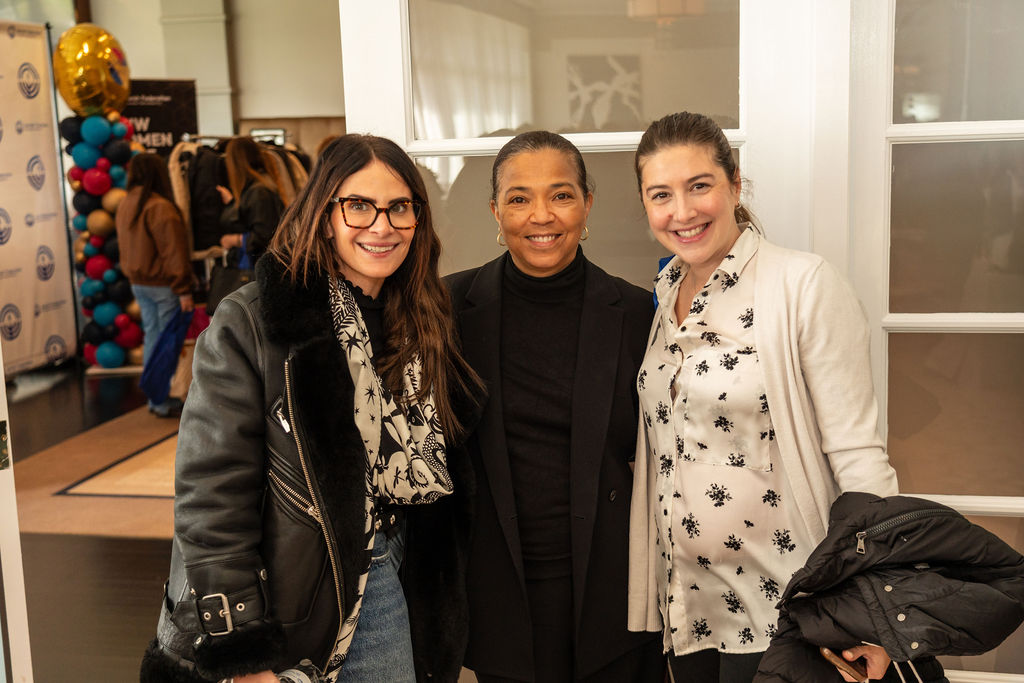 Three women standing next to each other at a NextGen event.